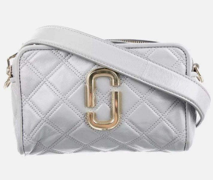 Authentic Marc Jacobs Quilted Soft Shot 21 (Category: Luxury Bags & Wallets) located in Rosario. Submitted by myvinatgepieces (Listing ID 1310549563, Image 1). Description: Authentic Marc Jacobs Soft shot 21 Ivory Color An oversized double-J logo gleams from a supple, quilted leather bag you can carry as a clutch or sling over your shoulder with the optional strap. Quilted Lambskin Leather Replaced Original MJ Guitar Strap Minimal Color Transfer 