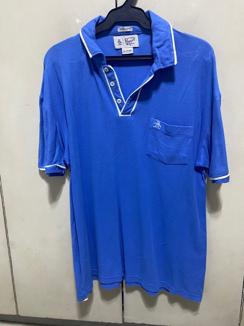 Penguin - Blue Polo Shirt (Category: Tshirts & Polo Shirts ) located in San Juan City. Submitted by random_finds (Listing ID 1310552720, Image 1). Description: Decluttering old and used shirts. As is and used condition. Please check photos for reference on quality.