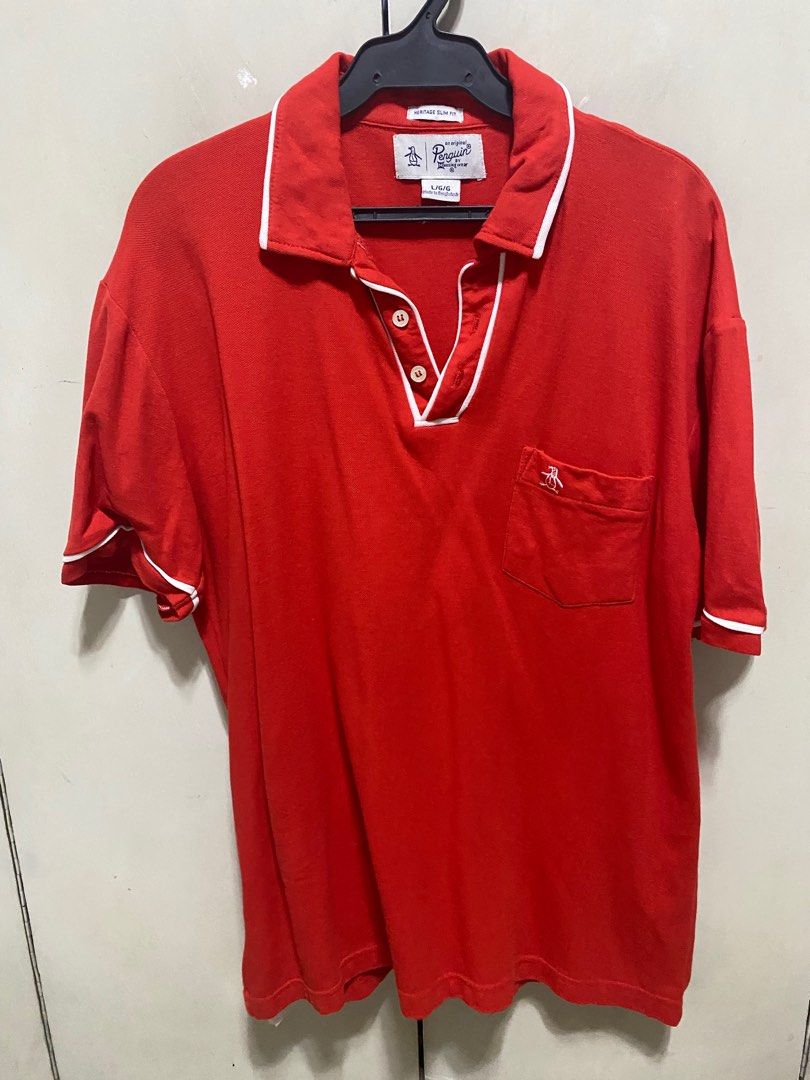 Penguin - Red Polo Shirt (Category: Tshirts & Polo Shirts ) located in San Juan City. Submitted by random_finds (Listing ID 1310552551, Image 1). Description: Decluttering old and used shirts. As is and used condition. Please check photos for reference on quality.