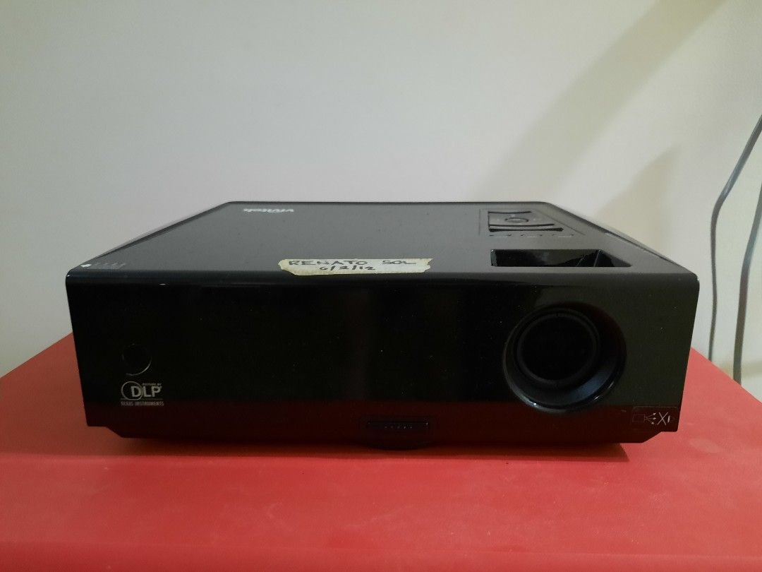 Vivitek DLP Projector (Category: Projectors) located in Las Pinas. Submitted by cabinetchasu (Listing ID 1310487319, Image 1). Description: Please read before messaging Vivitek DLP Projector Not sure what exact model, would need to double check Condition: AS IS Flaws: My dad who used to own this said na hindi na daw to nagana. I tried testing it one time by turning it on at gumana naman, may lumabas naman sa projector na default loading but could