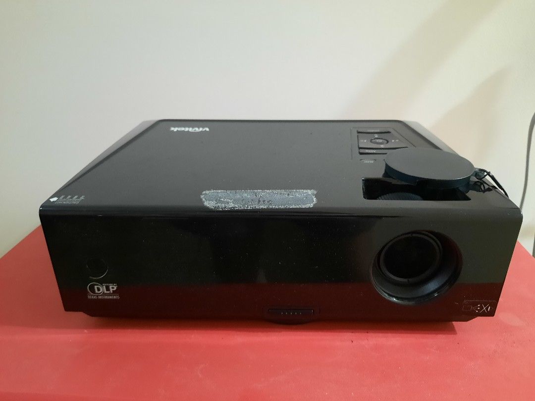 Vivitek DLP Projector (Category: Projectors) located in Las Pinas. Submitted by cabinetchasu (Listing ID 1310487319, Image 2). Description: Please read before messaging Vivitek DLP Projector Not sure what exact model, would need to double check Condition: AS IS Flaws: My dad who used to own this said na hindi na daw to nagana. I tried testing it one time by turning it on at gumana naman, may lumabas naman sa projector na default loading but could