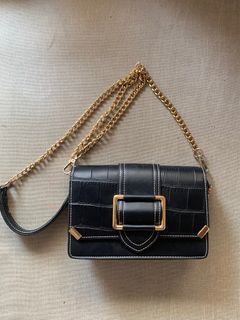 Black cross-body bag with gold hardware