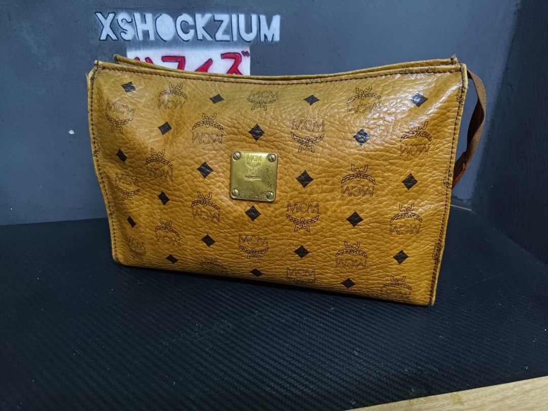 Mcm clutch bag price best sale
