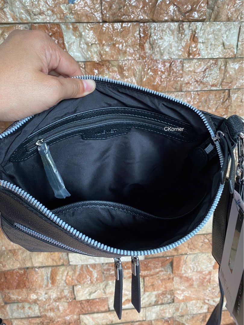 Nine West Messenger Bag / Sling Bag (Category: Cross-body Bags) located in Lipa City. Submitted by _flor_ (Listing ID 1310725634, Image 3). Description: Nine West Messenger Bag / Sling / Crossbody Bag with Detachable Card Holder Onhand, ready to ship 100% Authentic from US Actual measurement on photos Php 2,750 plus sf Location: Lipa City Courier: LbC **Item’s color may slightly vary due to lighting sources and/or your screen settings PM to order