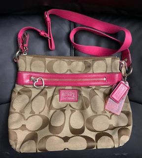Original preloved Coach sling canvass with pink linings and strap
