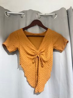 asymmetrical orange top