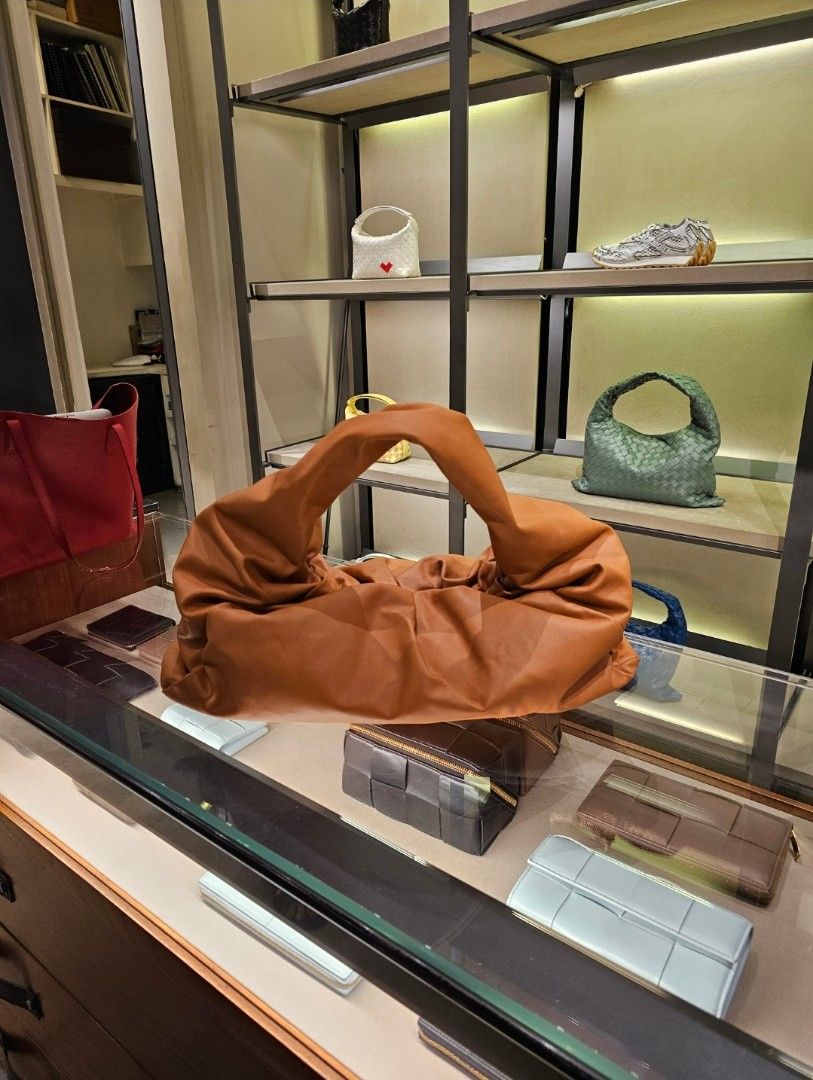 Bottega Veneta Shoulder Pouch Large AUTHENTIC (Category: Luxury Bags & Wallets) located in Quezon City. Submitted by misspatchea (Listing ID 1310986510, Image 2). Description: NEGOTIABLE. Original price when first launched was around 200k pesos. Selling at around the price I paid for. Bought from Bottega Veneta in Shangri-la Mall (June 2024). RFS: Impulse buy. Comes with dustbag and paperbag..