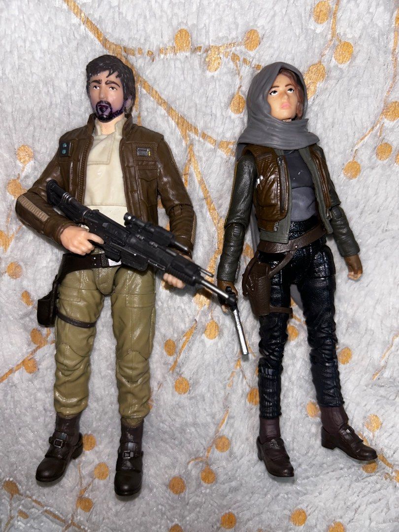 Cassian Andor & Jyn Erso Figures from Black Series 3-Pack (Category: Figurines & Statues) located in Marikina City. Submitted by nigeljames (Listing ID 1310975672, Image 1). Description: Take both for ₱299. Complete accessories. Issues: - Cassian Andor figure has purple marker discoloration around beard area. - Joints are a bit loose on the Jyn Erso figure. Message me for offers or inquiries..