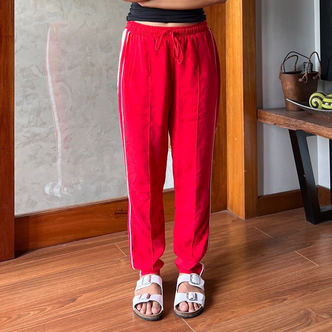 Red sporty trousers (Category: Other Bottoms) located in Las Pinas. Submitted by pretending2be (Listing ID 1310916497, Image 1). Description: Minir Flaw w/ rip on the side but can be sewn back on!! Model Height: 5’1 Size: S MOD: Flash \ GGX (I do not offer JNT) Note: MOD should be shouldered by buyer .