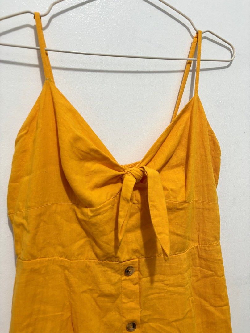Bershka Tie Front Dress (Category: Dresses) located in Quezon City. Submitted by baaaj_ (Listing ID 1311164958, Image 3). Description: ✨ Size: L on tag (best fit M) ✨ With back zipper ✨ Adjustable straps ✨ The buttons are just for design ✨ Flaw: the garter on smocking part is not perfect.