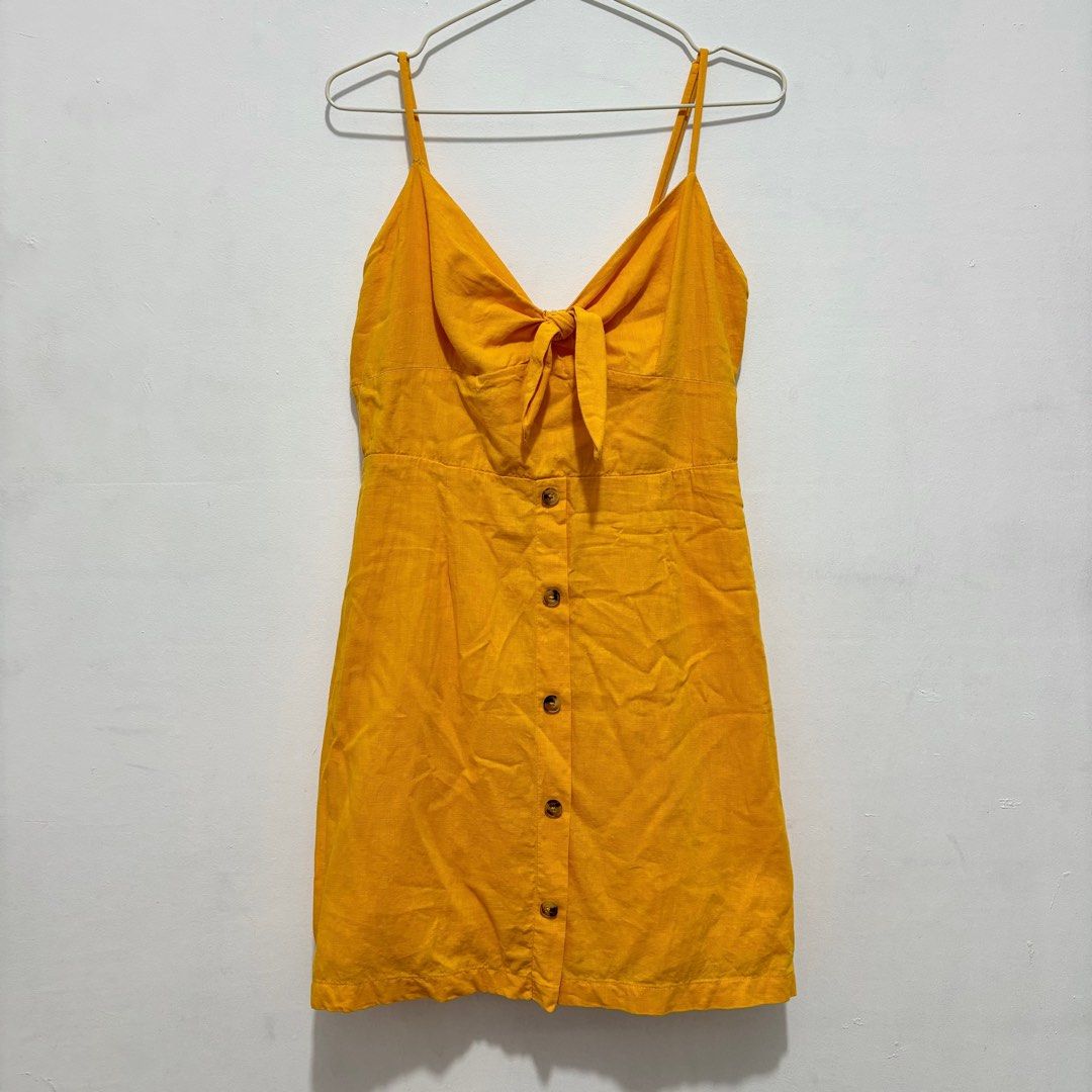 Bershka Tie Front Dress (Category: Dresses) located in Quezon City. Submitted by baaaj_ (Listing ID 1311164958, Image 2). Description: ✨ Size: L on tag (best fit M) ✨ With back zipper ✨ Adjustable straps ✨ The buttons are just for design ✨ Flaw: the garter on smocking part is not perfect.