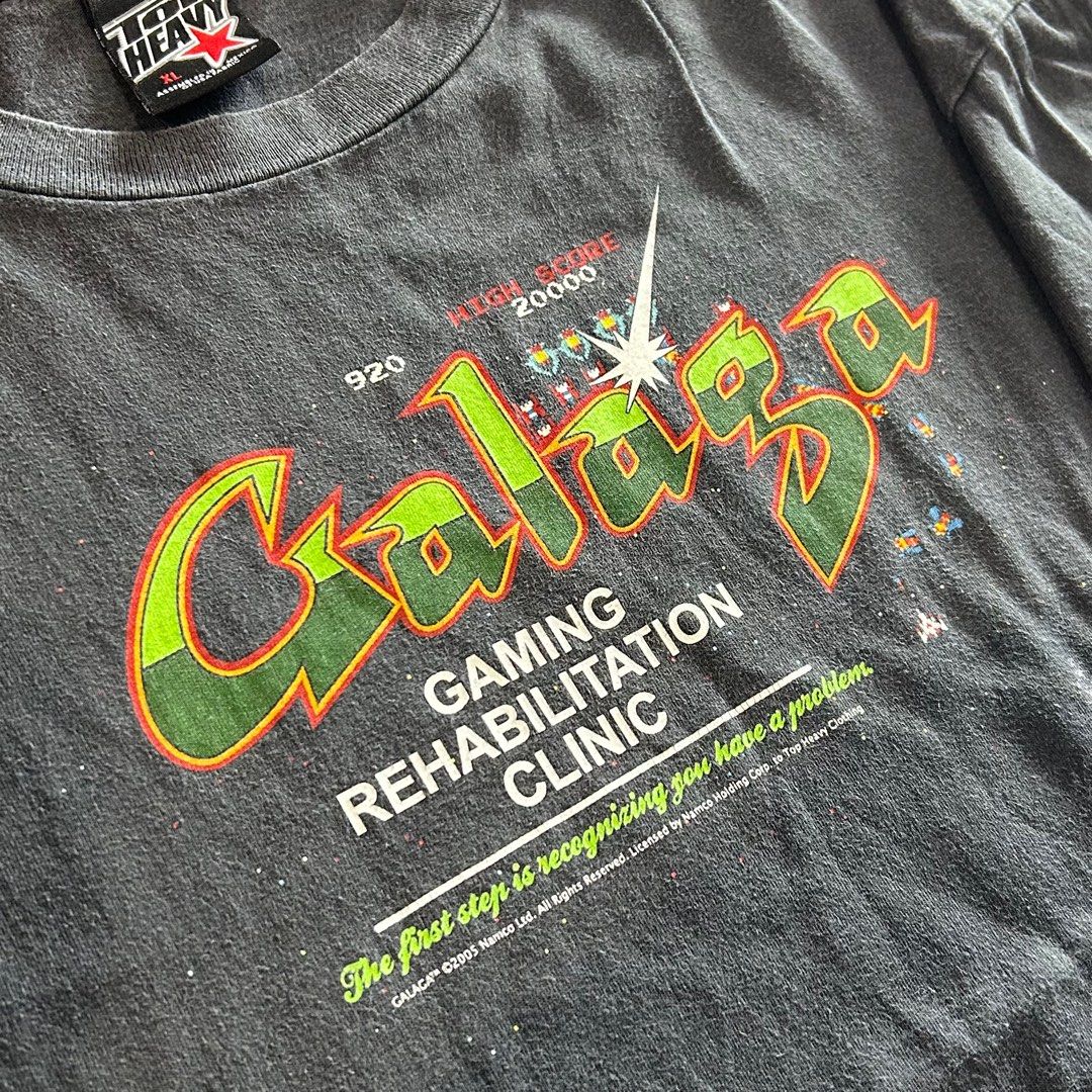 Galaga Gaming Tee (Category: Tshirts & Polo Shirts ) located in Quezon City. Submitted by roelleg (Listing ID 1311083955, Image 2). Description: Galaga Gaming Tee • Rare 2005 Galaga Gaming Promo Tee • Licensed by Namco Corp • Top Heavy Tag XL • 22.5 Width x 30 Length • With Galaga Sleeve Hit • Good F A D I N G • Loose Hem Stitching (Only Issue) • Double Stitch All Over ₱2,500 Only🫶 ✈️ JNT | LBC | Lalamove 🫶🏻 Gcash 📍 Quezon City.
