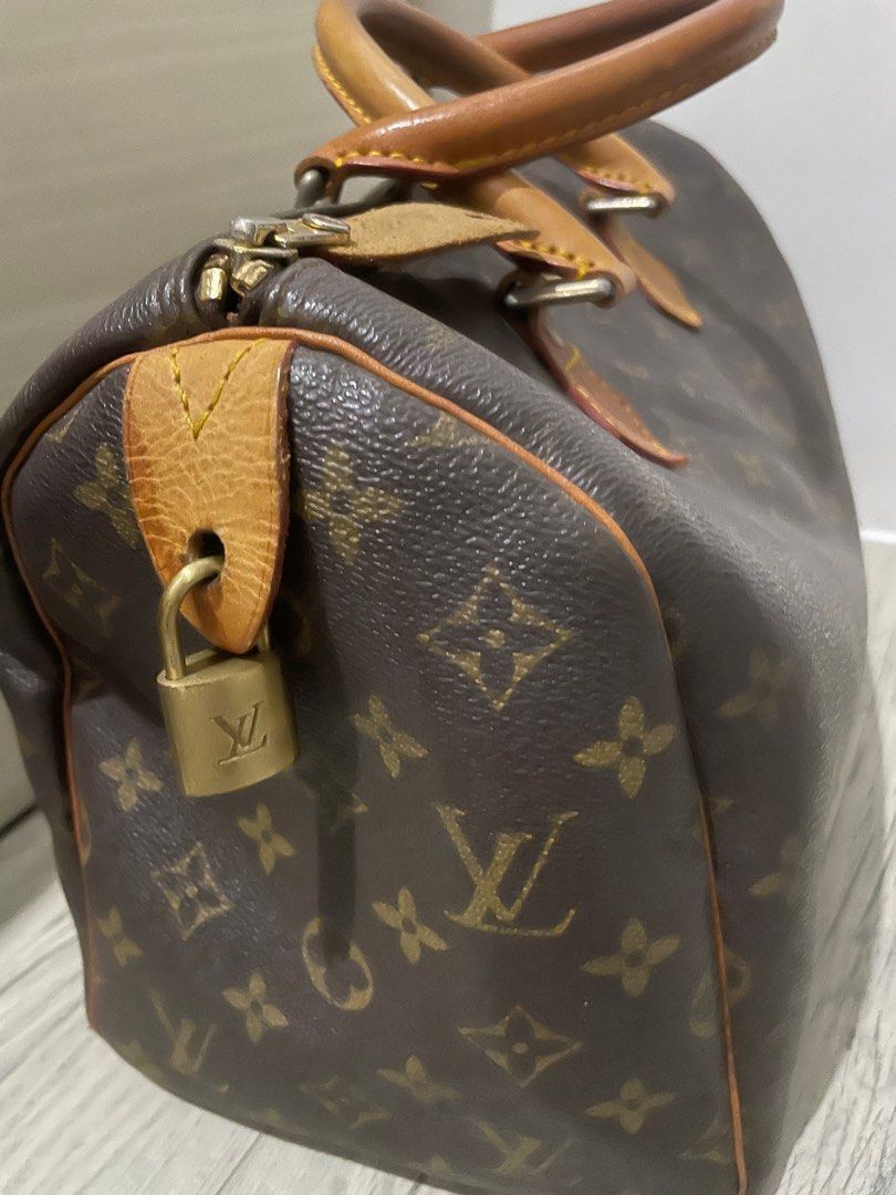 Louis Vuitton Speedy 30 (Category: Luxury Bags & Wallets) located in Pasig City. Submitted by chellim (Listing ID 1311320584, Image 2). Description: Selling preloved LV Speedy 30 Still in good condition Re-upholstered inside Sourced from Japan (online seller) No inclusions (bag and padlock only) .