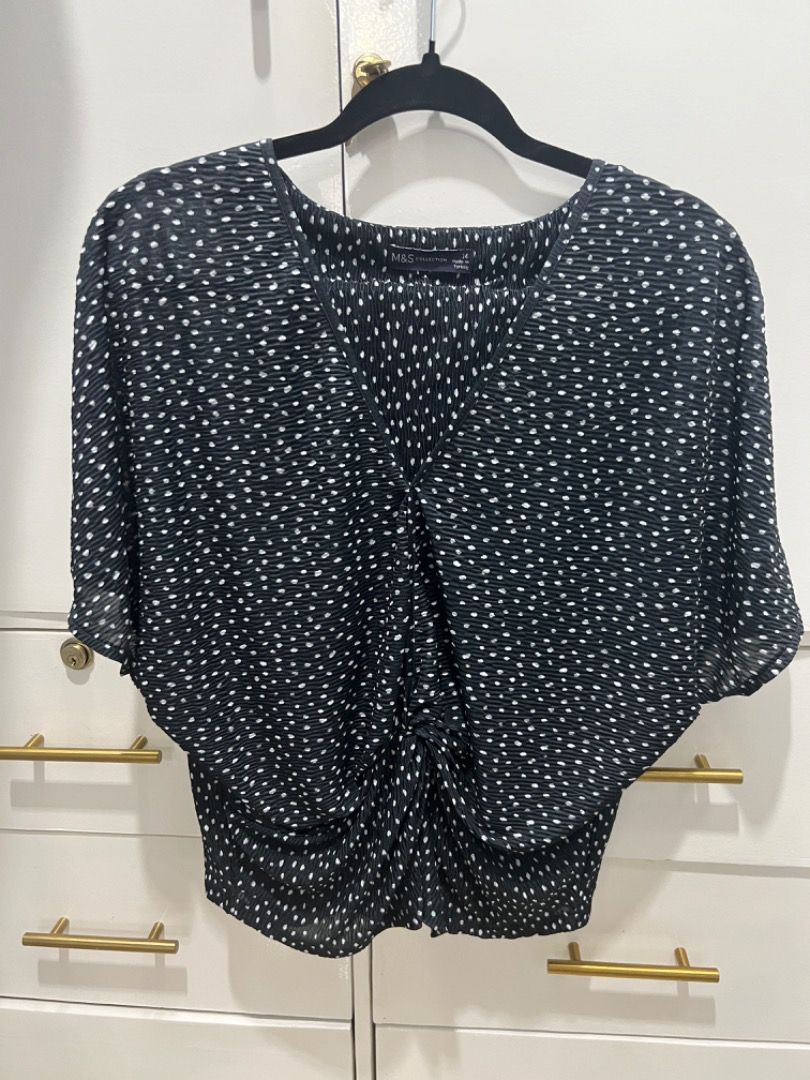 Marks & Spencer Polka Dot Twist Front Short Sleeves Blouse (Category: Blouses) located in Carmona. Submitted by raest16 (Listing ID 1311263807, Image 1). Description: Unused Blouse. Washed and was stored. Black Polka Dots, V-neck and has twist in the tummy area Size: UK 14 MOP: Cgash, BDO Shipping: LBC, Lalamove c/o Buyer Location: Carmona Cavite.