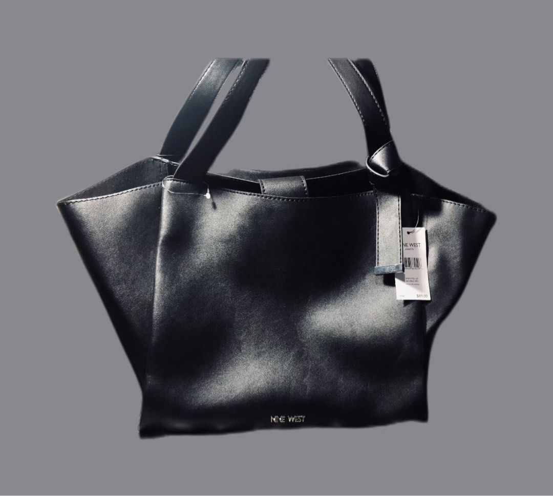 Nine west Black Ankita Tote (Category: Shoulder Bags) located in Malabon City. Submitted by jillmolo (Listing ID 1311219862, Image 1). Description: SALE SALE SALE Brand new Ninewest Totebag Fauc leather, open top , magnetic snap vlosure, dual slip pockets 12”L x 11”H x 4 1/2”W.