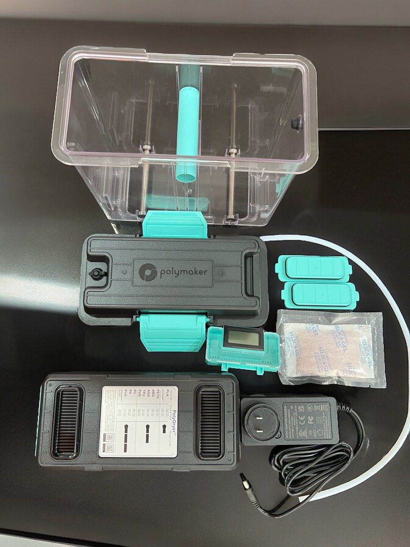 Polymaker PolyDryer (Category: Printers, Scanners & Copiers) located in Singapore. Submitted by reify3d (Listing ID 1311382204, Image 3). Description: Brand new in box Polymaker PolyDryer for sale. Photos are my demo unit to show what it looks like. Items: • PolyDryer heating unit • 100-240V power supply, EU style 2-pin plug • Desiccant • Instruction manual • PTFE tube • Injection molded holder (for cardboard spools) • Humidity level LCD display 