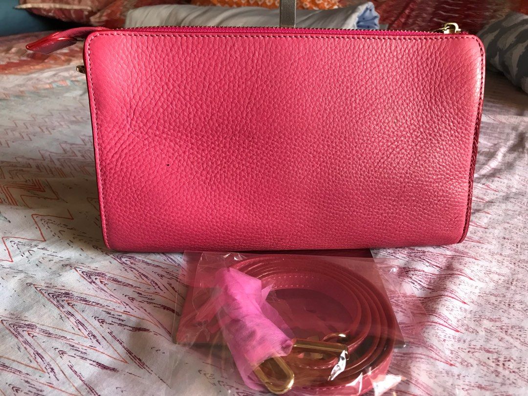 Tory Burch Sling Bag (Category: Luxury Bags & Wallets) located in Santa Rosa. Submitted by rina.rina3 (Listing ID 1311356521, Image 2). Description: Tory Burch hot pink cute bag with detachable adjustable sling Preowned from Korea With minimal signs of use on hardwares as seen in photos But overall condition is excellent Rubber linings all intact 9.5in x 1in x 5.5in Buyer to shoulder shipping fee .