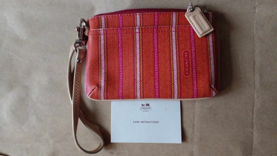 Authentic Coach Small Wristlet (Category: Luxury Bags & Wallets) located in Pasig City. Submitted by onnahvale20617 (Listing ID 1306884128, Image 1). Description: -pre-loved chich Coach wristlet to wear on your wrist or clip it inside a larger Coach bag -comes with care card and original Coach product tag -detachable wrist strap -zip-top closure, clean fabric lining -two credit card slots inside, extra slot in front -dimensions: 6" x 4" -Preferre
