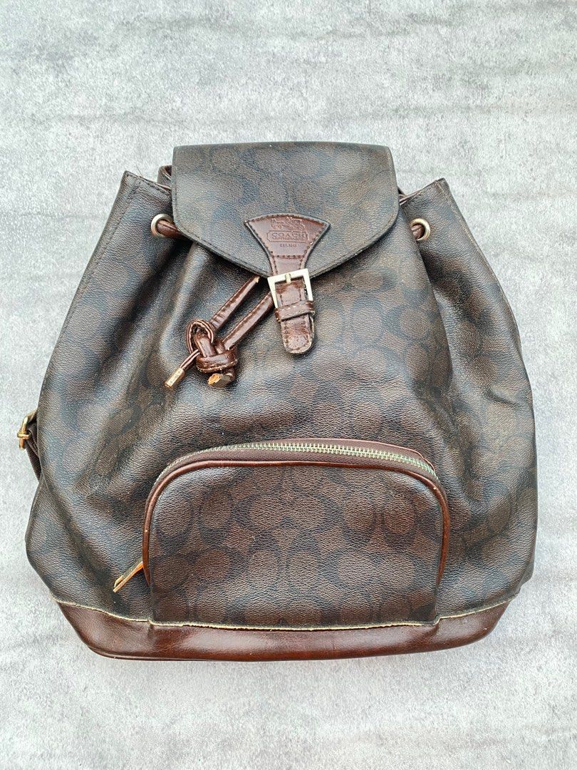 Coach Signature Monogram Mini Backpack (Category: Luxury Bags & Wallets) located in Quezon City. Submitted by curatedandholygrails (Listing ID 1306809655, Image 1). Description: 7/10 Condition - Slight Leather Cracking Underneath and Zipper Stock (Can be brush) + Shipping Fee.