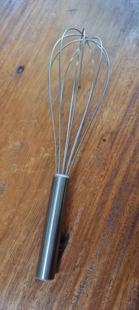 Stainless Steel Wire Whisk for baking (Category: Bakeware) located in Quezon City. Submitted by m_decluttering_sale (Listing ID 1306803723, Image 1). Description: 🥄 Vintage Stainless Steel Whisk 📍 Condition: Well-used but still sturdy and functional 🍳 Ideal for whisking eggs, mixing sauces, baking, and other kitchen tasks ✨ Classic vintage design — durable and easy to clean 📏 Lightweight and handy size, perfect for everyday cooking 💸 Price: 