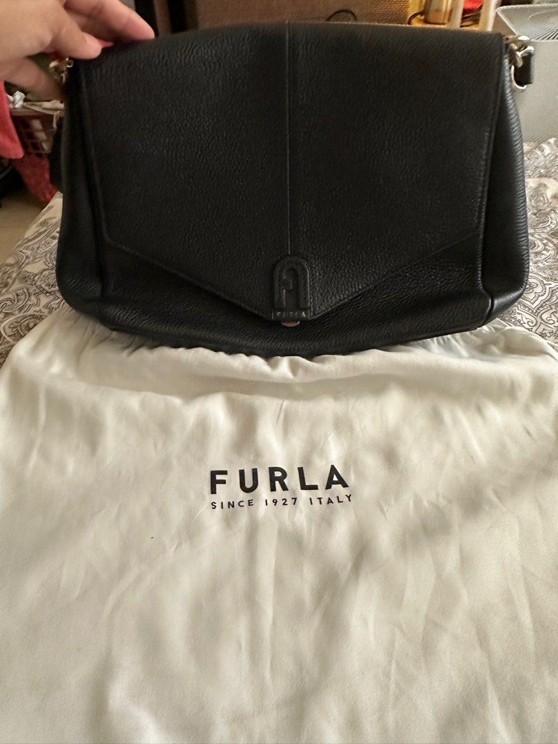 Authentic Furla Black Leather Bag (Category: Luxury Bags & Wallets) located in Mandaluyong City. Submitted by hdvvv (Listing ID 1311536814, Image 2). Description: Black leather bag from Furla Bought in Paris for Eur 600 Really really good quality bag. Long and short shoulder strap. Functional and chic. Inclusions - dustbag and strap Meetup encouraged so you can check the quality and beauty of the bag Rfs: Funding a new bag.
