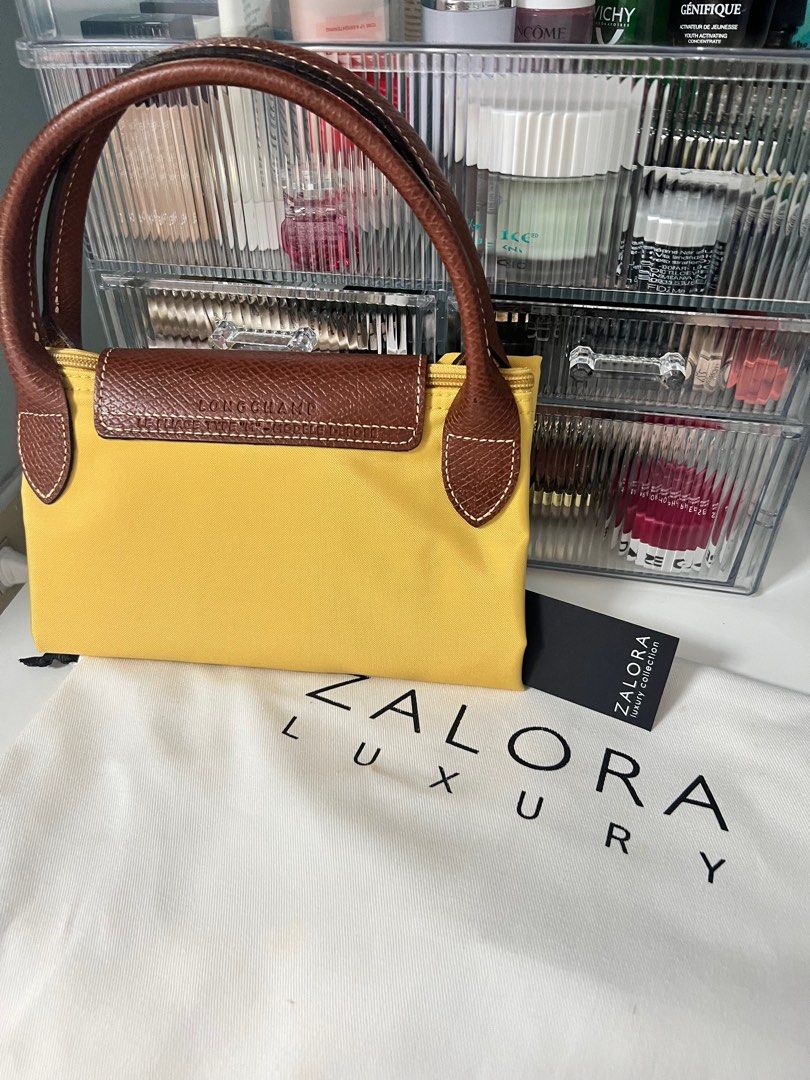 AUTHENTIC Longchamp medium short handle (Category: Luxury Bags & Wallets) located in Mendez-Nunez. Submitted by ishoptilidrop (Listing ID 1311562693, Image 2). Description: BNWT from Zalora SG Bought for around 9k php Pls arrange your own pickup.