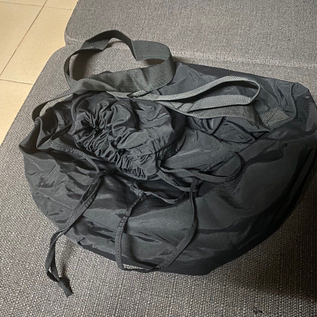 Black drawstring tote bag (Category: Tote Bags) located in Manila. Submitted by ranze (Listing ID 1311660187, Image 1). Description: Good to match with street wear outfits. Bought it on tiktok shop. .