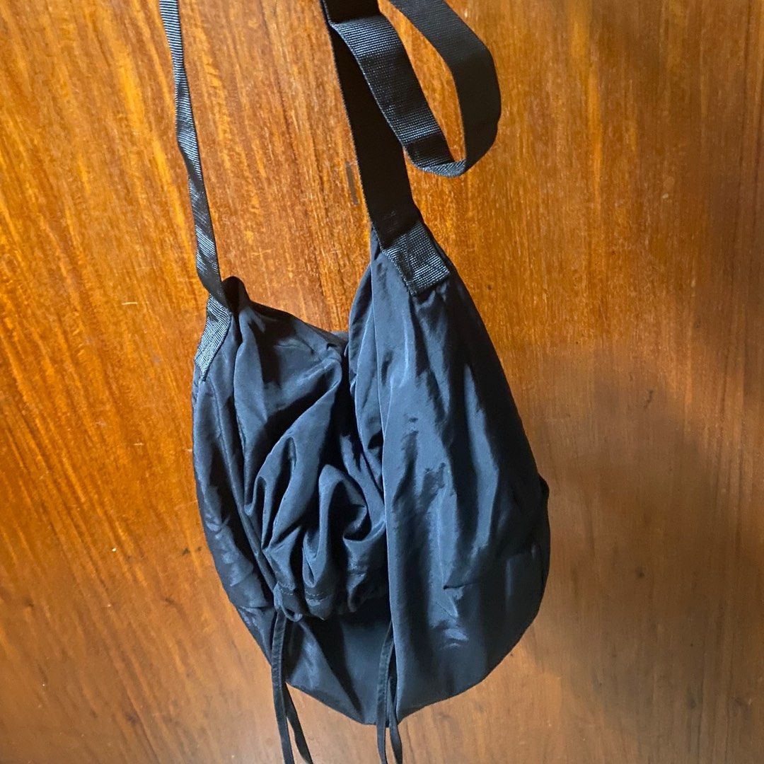 Black drawstring tote bag (Category: Tote Bags) located in Manila. Submitted by ranze (Listing ID 1311660187, Image 3). Description: Good to match with street wear outfits. Bought it on tiktok shop. .