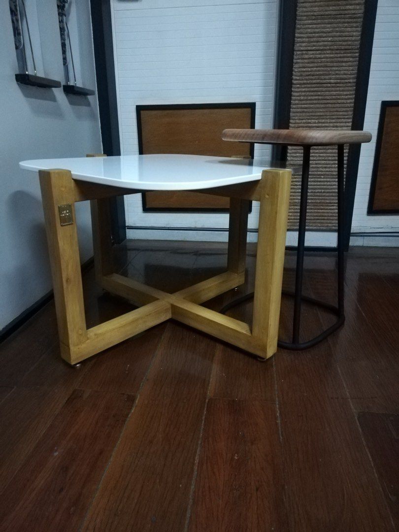 Coffee table (Category: Tables & Sets) located in Paranaque City. Submitted by mcab_ (Listing ID 1311619620, Image 3). Description: Coffee Table set • Made with Mahogany solid wood • White synthetic granite top • Solid wood nesting table top w/ matte black PU finish metal base • Stainless steel adjustable gliders Php 14,800 Coffee table size: 67cm length 67cm width 45cm height Nesting table size: 30cm length 30cm width 50cm height.