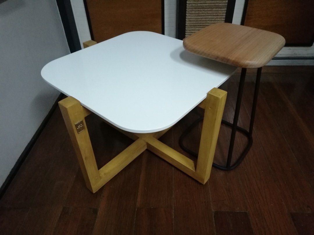 Coffee table (Category: Tables & Sets) located in Paranaque City. Submitted by mcab_ (Listing ID 1311619620, Image 2). Description: Coffee Table set • Made with Mahogany solid wood • White synthetic granite top • Solid wood nesting table top w/ matte black PU finish metal base • Stainless steel adjustable gliders Php 14,800 Coffee table size: 67cm length 67cm width 45cm height Nesting table size: 30cm length 30cm width 50cm height.