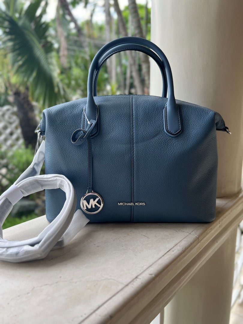 MICHAEL KORS - Hyde Leather Satchel - Large (Category: Tote Bags) located in Manila. Submitted by offthenest (Listing ID 1311586855, Image 1). Description: Brand: Michael Kors Model: Hyde Leather Bag Color: Denim Size: Large Original Price: $628.00 Origin: Bought in the US Others: Authentic; With paperbag SIZE: 16”W X 11”H X 5”D PRODUCT DETAILS: Adjustable & detachable long strap Zip fastening Interior details: back zip pocket & front slip pocket