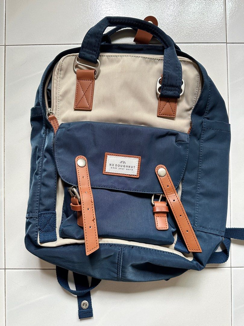 Backpack (Category: Backpacks) located in Singapore. Submitted by bunnytoothx (Listing ID 1306901065, Image 5). Description: Brand new without tag. Comfortably fits 13" laptop. Multiple inner pockets and zips as shown in the photos. Has 2 inner side pockets for umbrella/water bottle. Very functional bag. Selling as underutilised. .