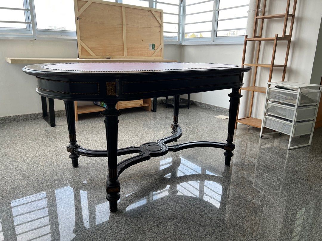 Dining Table / Office Table with Leather Surface (Category: Tables & Sets) located in Singapore. Submitted by bealohkf (Listing ID 1306889839, Image 1). Description: Black with Red leather top Vintage French table. Used as office table. Bought in Paris Marais antique shop and shipped back to Singapore. Great center piece. Self collection..