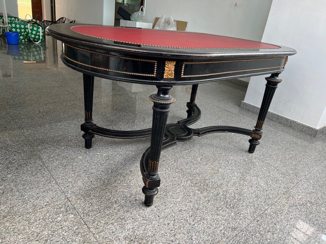 Dining Table / Office Table with Leather Surface (Category: Tables & Sets) located in Singapore. Submitted by bealohkf (Listing ID 1306889839, Image 3). Description: Black with Red leather top Vintage French table. Used as office table. Bought in Paris Marais antique shop and shipped back to Singapore. Great center piece. Self collection..
