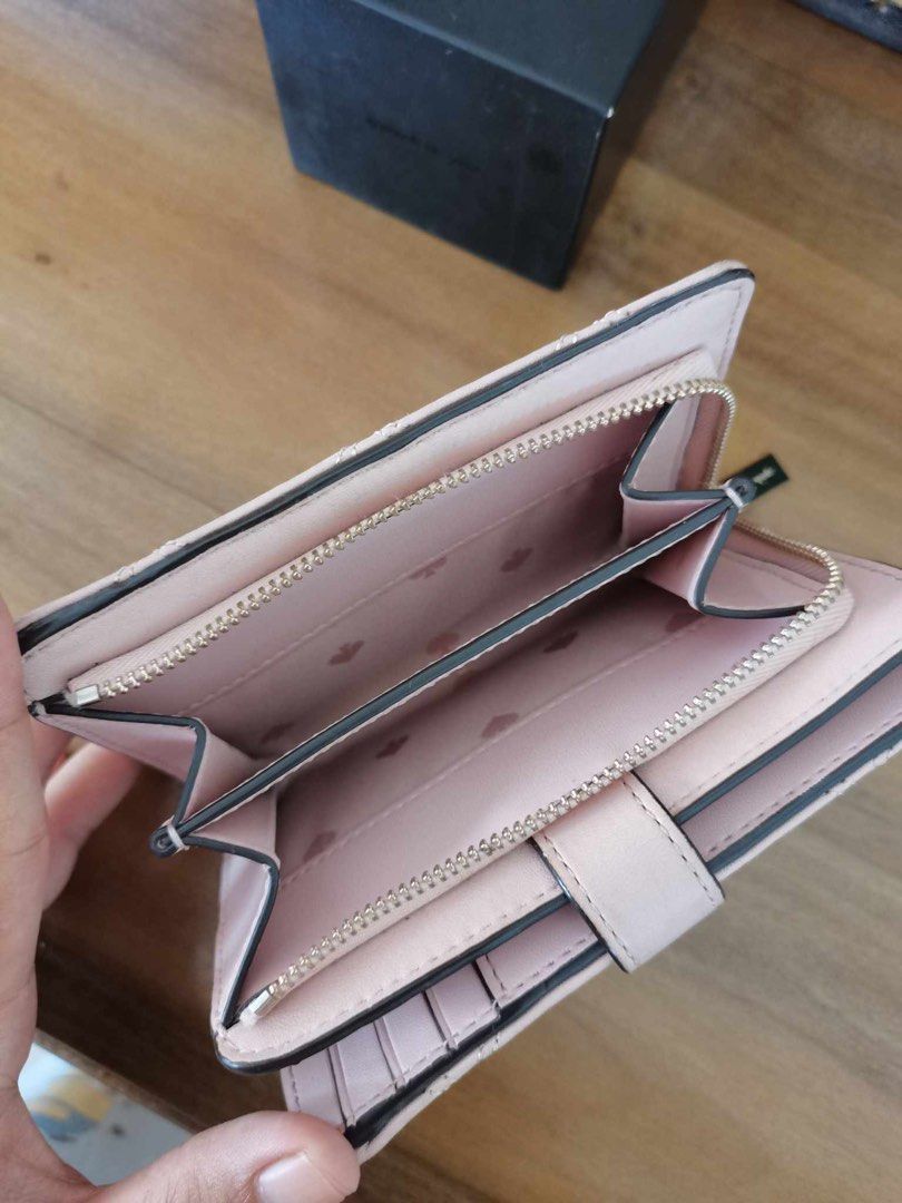 Katespade medium wallet in pink (Category: Wallets & Card holders) located in Clarin. Submitted by declutter_station101 (Listing ID 1307053219, Image 3). Description: I only used twice nkatambak na. I shift to smaller size of wallet since I want a smaller sizes of bag goin to work because its light to carry. Money back if proven fake. Price is fixed..