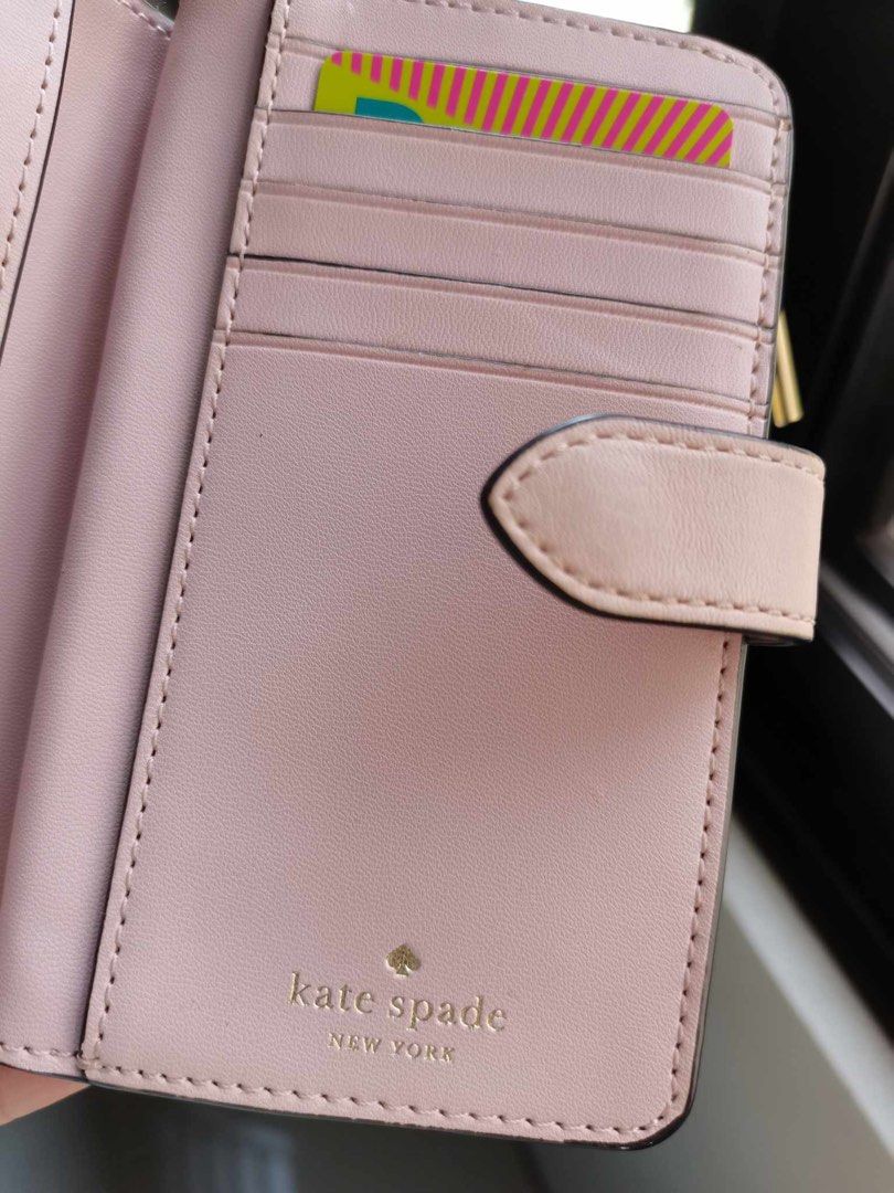 Katespade medium wallet in pink (Category: Wallets & Card holders) located in Clarin. Submitted by declutter_station101 (Listing ID 1307053219, Image 2). Description: I only used twice nkatambak na. I shift to smaller size of wallet since I want a smaller sizes of bag goin to work because its light to carry. Money back if proven fake. Price is fixed..
