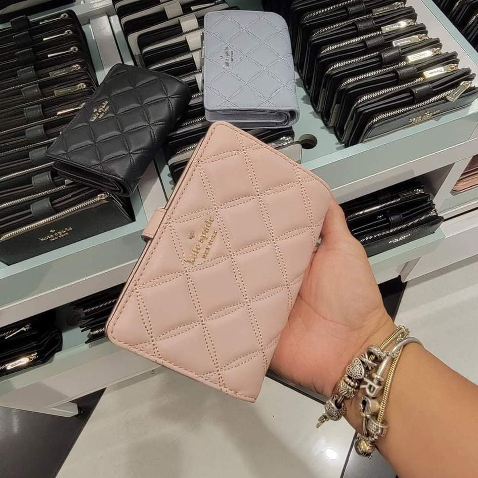 Katespade medium wallet in pink (Category: Wallets & Card holders) located in Clarin. Submitted by declutter_station101 (Listing ID 1307053219, Image 1). Description: I only used twice nkatambak na. I shift to smaller size of wallet since I want a smaller sizes of bag goin to work because its light to carry. Money back if proven fake. Price is fixed..