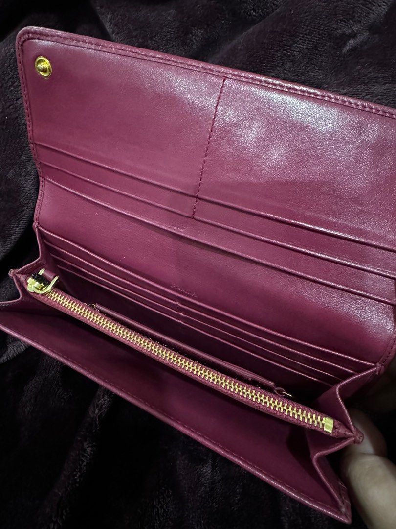 Preloved Prada Tessuto Long Wallet (Category: Luxury Bags & Wallets) located in Iligan City. Submitted by luckyshoppe77 (Listing ID 1306929835, Image 3). Description: Preloved Authentic Prada Long Wallet Original from Japan Red All genuine leather inside Leather and Tessuto nylon outside With minimal rubs on bottom edges Minimal signs of use No inclusions.
