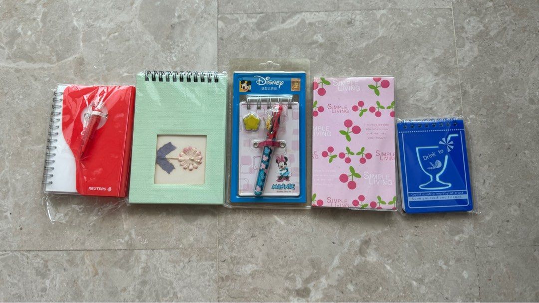 Assorted notebooks (Category: Stationery & School Supplies) located in Singapore. Submitted by messlia (Listing ID 1307134321, Image 1). Description: The small blue one -> $0.50.
