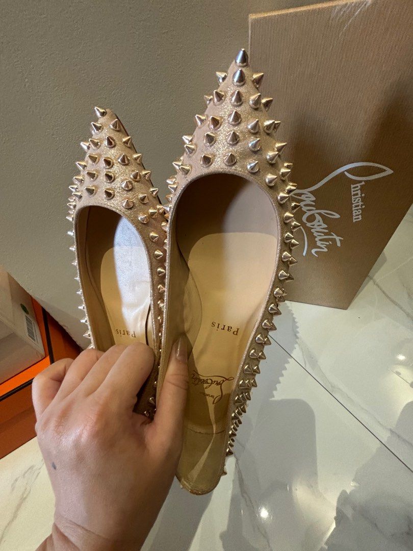 Christian Louboutin spike flats (Category: Sneakers & Footwear) located in Muntinlupa City. Submitted by bagaholicmom (Listing ID 1307204787, Image 2). Description: 💯 AUTHENTIC CL ballalla spikes flat In metallic suede apricot Rosegold hardware Used once Condition 9/10 With box and dustbag Size 35 True to size.
