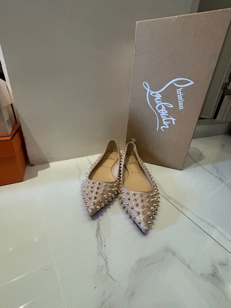 Christian Louboutin spike flats (Category: Sneakers & Footwear) located in Muntinlupa City. Submitted by bagaholicmom (Listing ID 1307204787, Image 1). Description: 💯 AUTHENTIC CL ballalla spikes flat In metallic suede apricot Rosegold hardware Used once Condition 9/10 With box and dustbag Size 35 True to size.