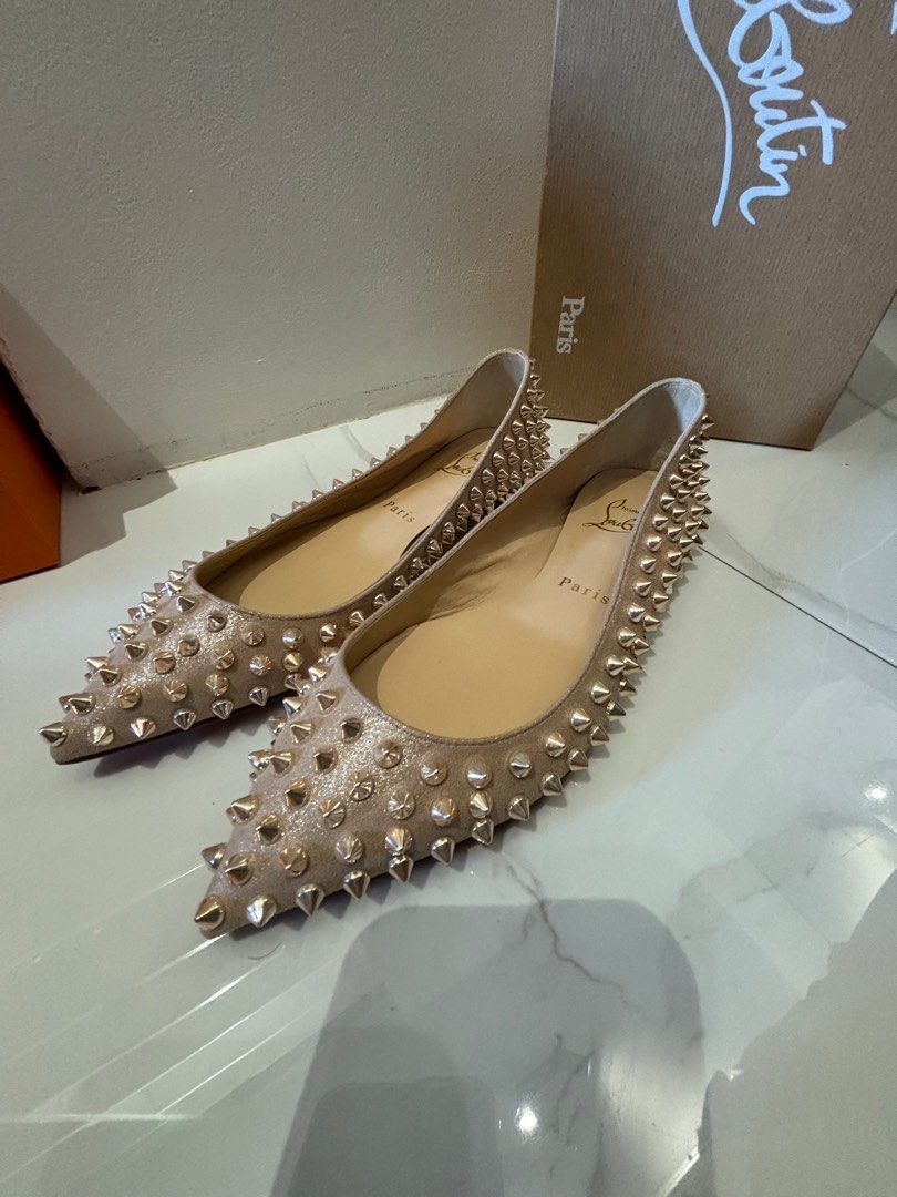 Christian Louboutin spike flats (Category: Sneakers & Footwear) located in Muntinlupa City. Submitted by bagaholicmom (Listing ID 1307204787, Image 3). Description: 💯 AUTHENTIC CL ballalla spikes flat In metallic suede apricot Rosegold hardware Used once Condition 9/10 With box and dustbag Size 35 True to size.