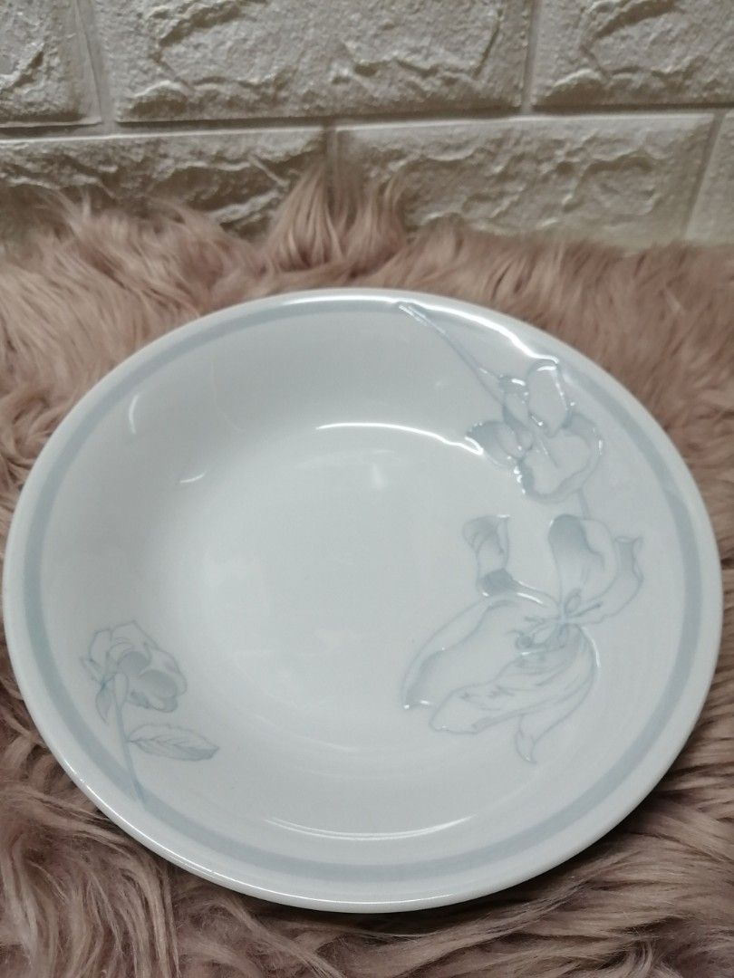 Givenchy Deep Plates (Category: Dinnerware & Cutlery) located in Manila. Submitted by rarefindsgallery (Listing ID 1307153465, Image 2). Description: Givenchy By Yamaka 2 Pcs Deep Plates Diameter : 8.5" Depth : 1.5" Porcelain plates with engraved floral design on plate Color blue gray print With minimal scratch due to storage Used as pasta plate or soup plate Made in Japan 🇯🇵 ₱599 for 2 plates.