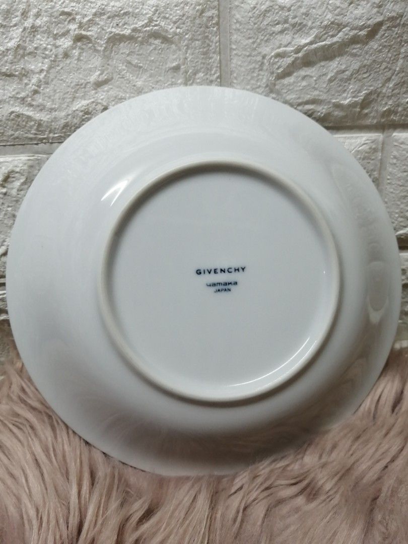 Givenchy Deep Plates (Category: Dinnerware & Cutlery) located in Manila. Submitted by rarefindsgallery (Listing ID 1307153465, Image 3). Description: Givenchy By Yamaka 2 Pcs Deep Plates Diameter : 8.5" Depth : 1.5" Porcelain plates with engraved floral design on plate Color blue gray print With minimal scratch due to storage Used as pasta plate or soup plate Made in Japan 🇯🇵 ₱599 for 2 plates.