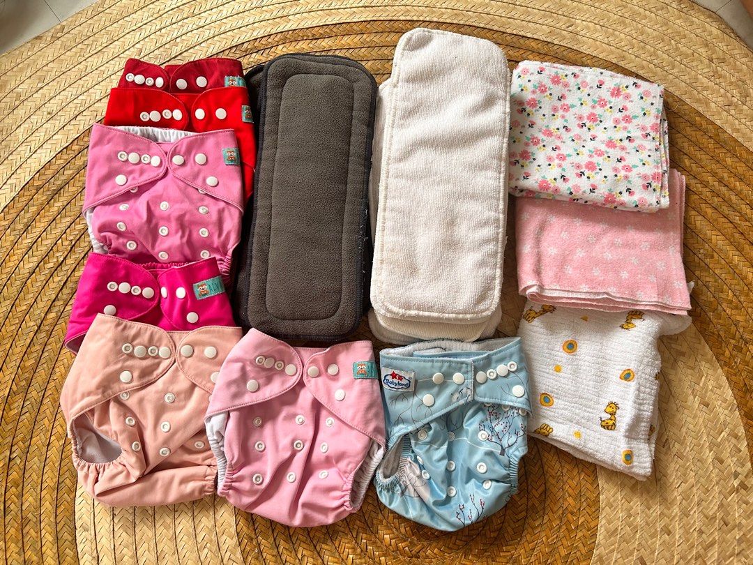 Reusable Cloth Diapers Bundle (Category: Diapers & Baby Wipes) located in Cavite. Submitted by samprelovedstuff (Listing ID 1307082580, Image 1). Description: - 12 pieces diaper inserts - 7 pieces cloth diapers - 3 burp cloths - fits to new born to 1 y.o.