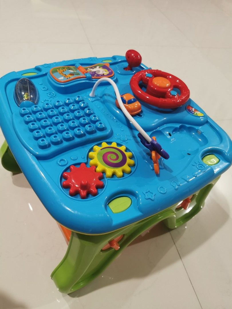 Activity Table (Category: Infant Playtime) located in Singapore. Submitted by tommolee (Listing ID 1307375677, Image 2). Description: Infant playtable.... Has building blocks, magnetic writing pad, rattlers, etc. Good for building hand eye coordination..