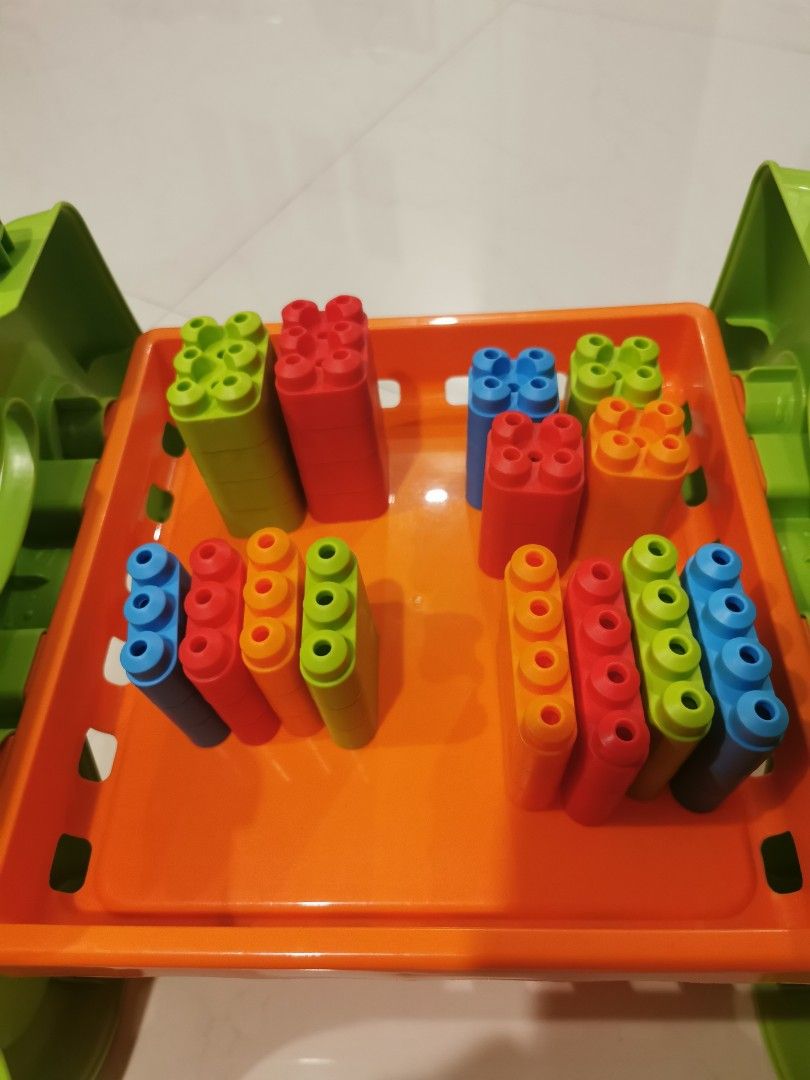 Activity Table (Category: Infant Playtime) located in Singapore. Submitted by tommolee (Listing ID 1307375677, Image 5). Description: Infant playtable.... Has building blocks, magnetic writing pad, rattlers, etc. Good for building hand eye coordination..