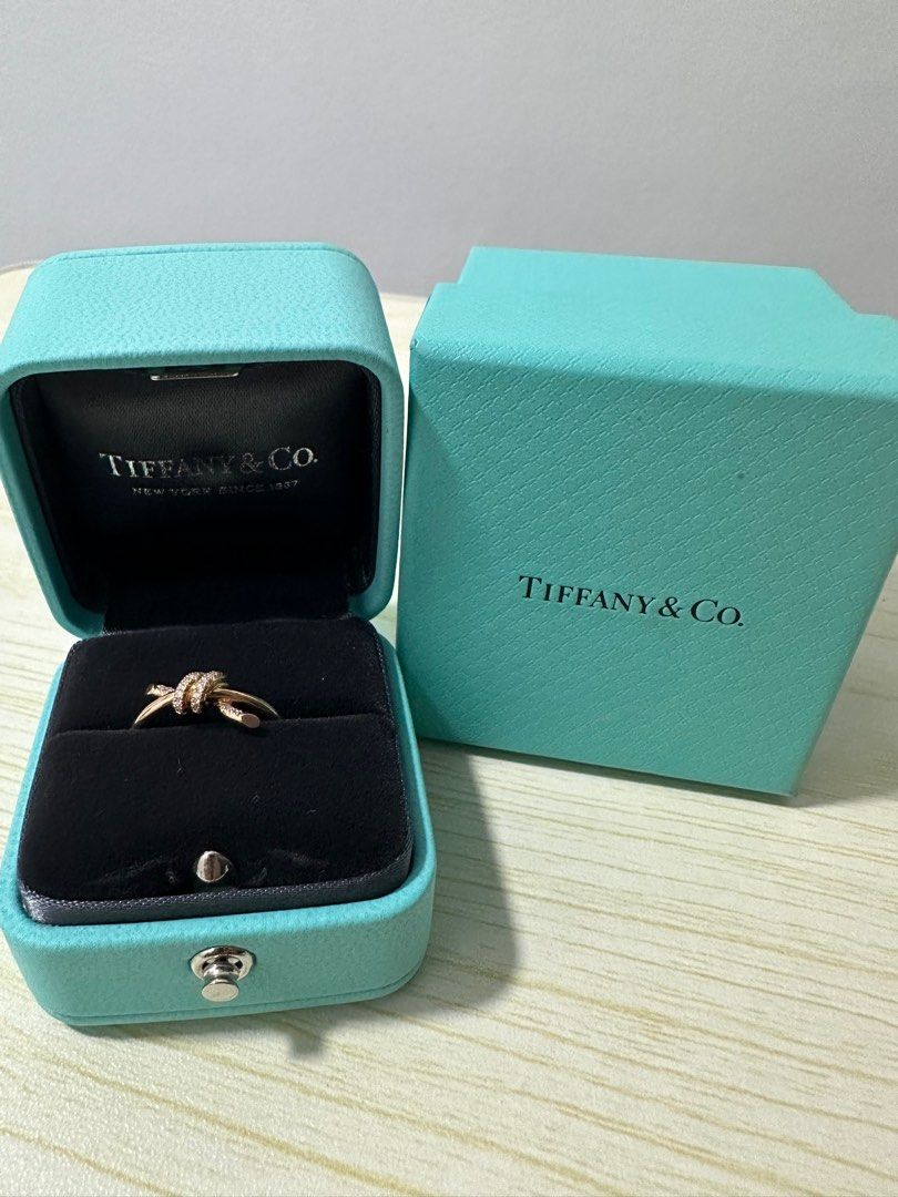 Authentic Tiffany Knot ring with diamonds in rose gold (Category: Body Jewelry) located in Marikina City. Submitted by evantaught (Listing ID 1307250882, Image 1). Description: Authentic Tiffany Knot ring with diamonds in rose gold 18k rose gold .09 carat diamond Size 6 Brand new, never used Comes with box RFS: Helping a friend to sell these to pay for her mother’s medical expenses Authentic item! Price is NEGOTIABLE! PM me your offers 😊.