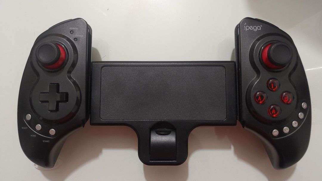 iPega PG-9023 (Category: Controllers) located in Mandaluyong City. Submitted by kinergy04 (Listing ID 1307397213, Image 1). Description: Selling my bluetooth controller. Used only once. Never opened / repaired. Still with box. RFS: switched platform..