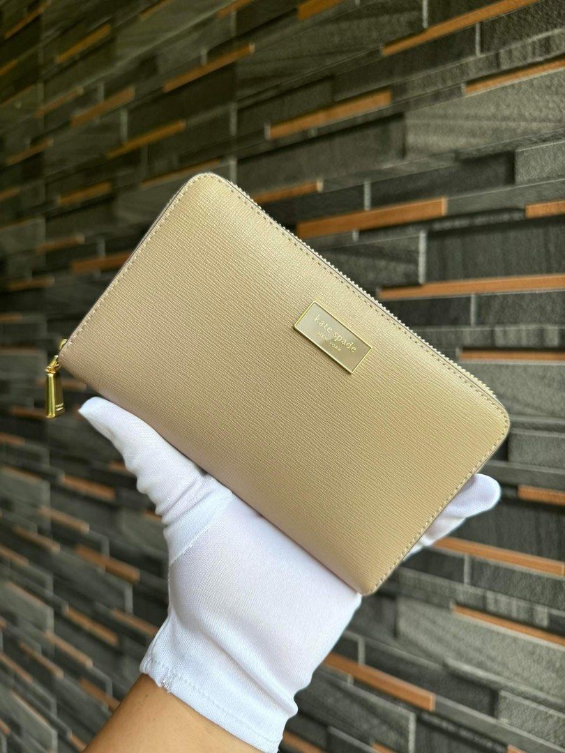 Kate spade wallet (Category: Wallets & Card holders) located in Mandaluyong City. Submitted by stuffnmore (Listing ID 1307312365, Image 1). Description: Ks zip around wallet Pinas onhand Inclusion polybag and carecard Guaranteed original and new.